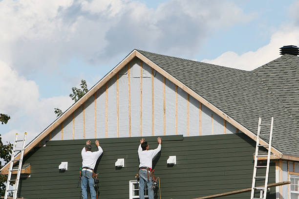 Professional Storm Damage Siding Repair technician working in Albemarle, NC